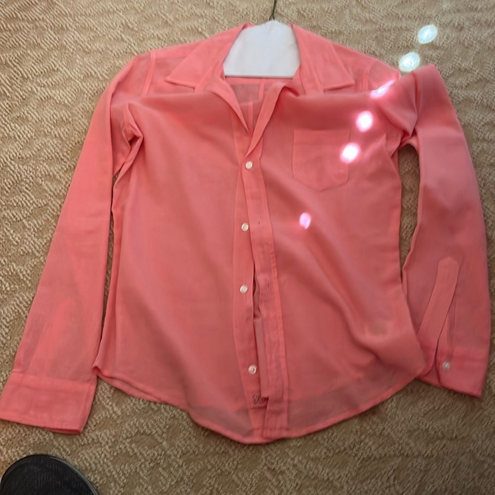 Woman’s pink blouse